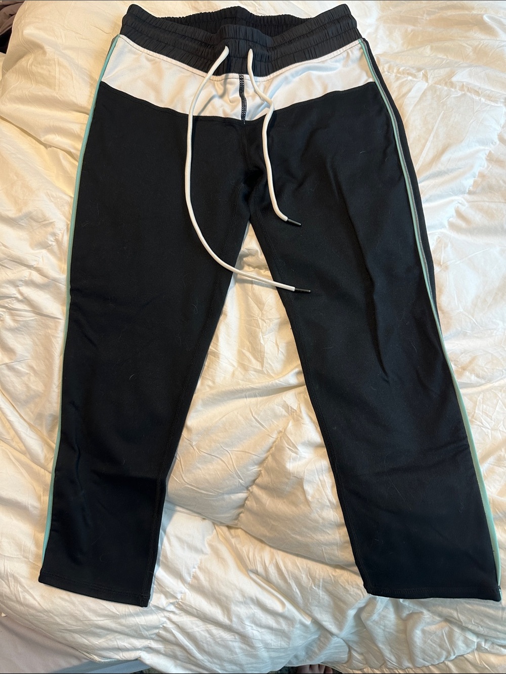 Black Track leggings with White Waistband and Mint Side Stripe. Tow front